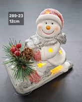 Decor ceramic Crăciun Om de Zăpadă pe sanie cu lumini LED - 12cm